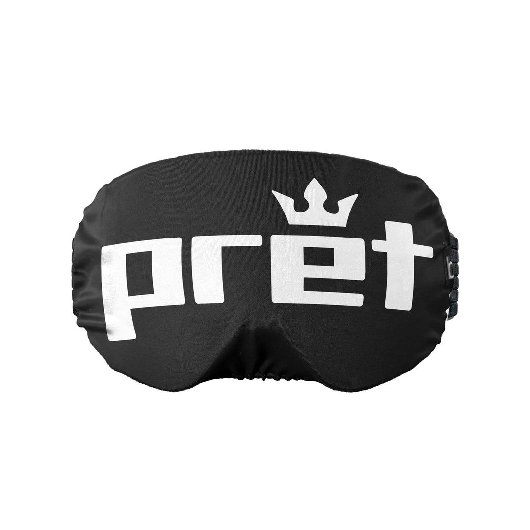 Black goggle cover with 'pret' logo on a white background