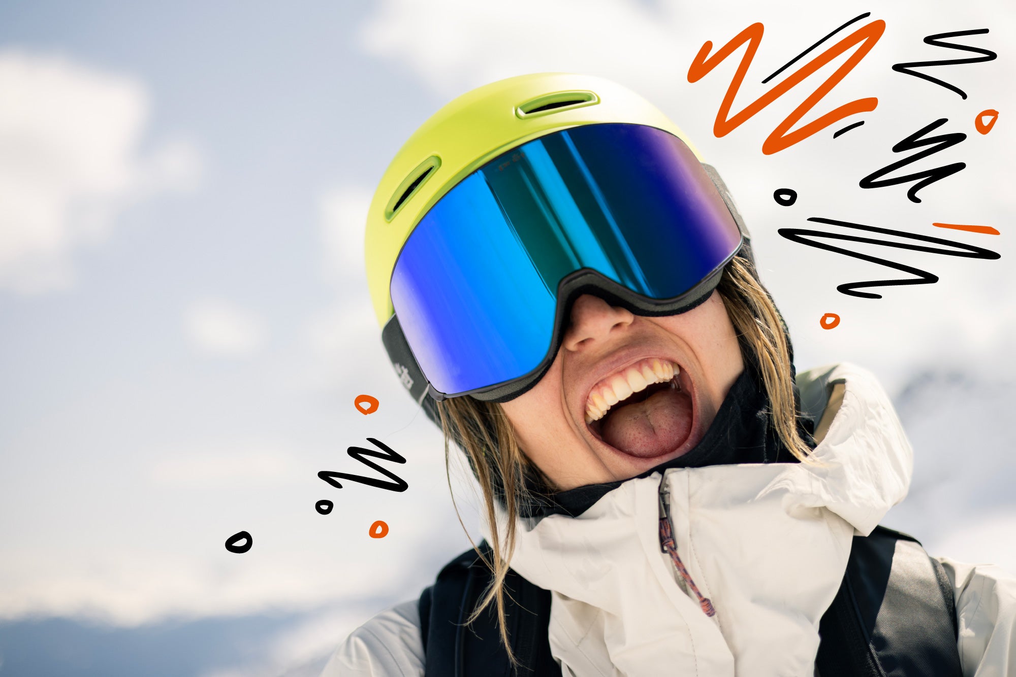 Person wearing a helmet with reflective goggles and a white jacket against a snowy background